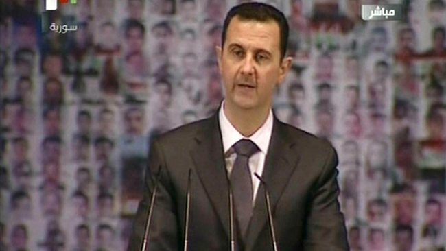 صورة بشار الأسد يبيع الاي باد: سوف أشتري جالاكسي باد مكانها